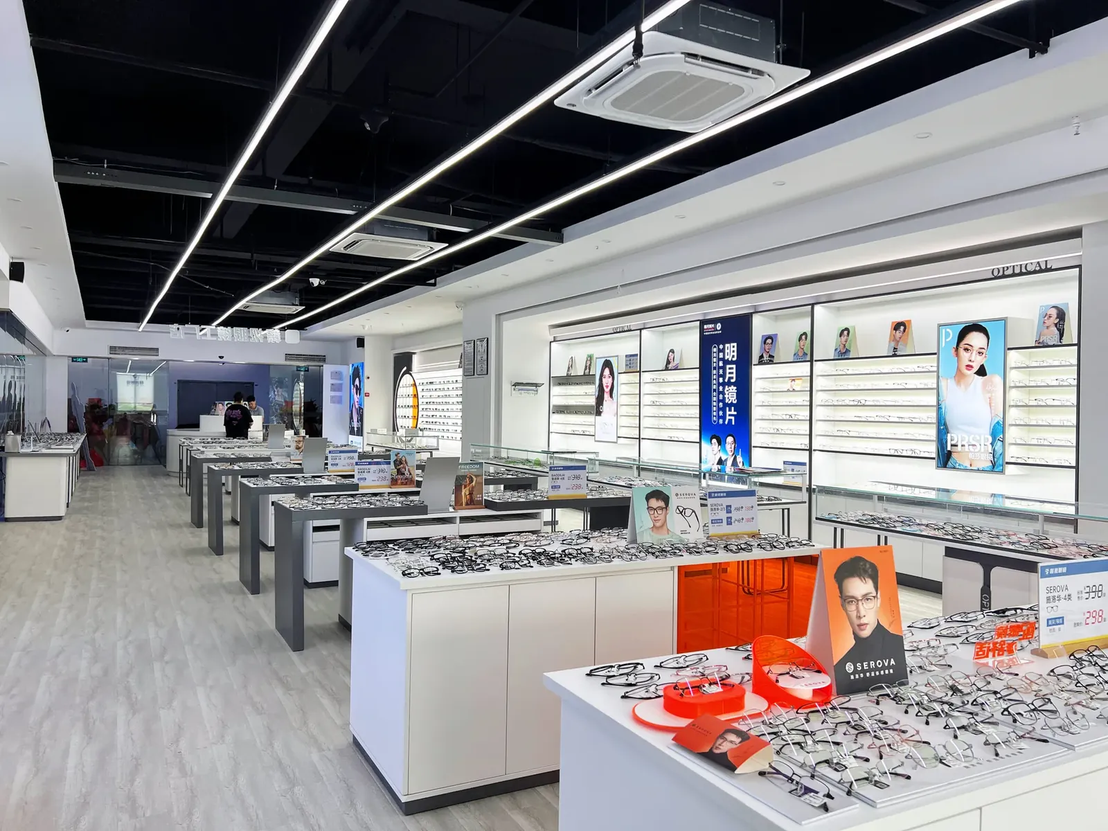 Interior of one of the group's self-run optical stores, showing eyewear display counters